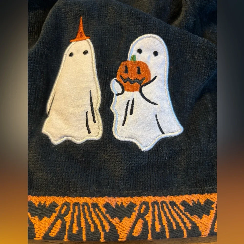 Hand crocheted full towel with embroidered ghosts